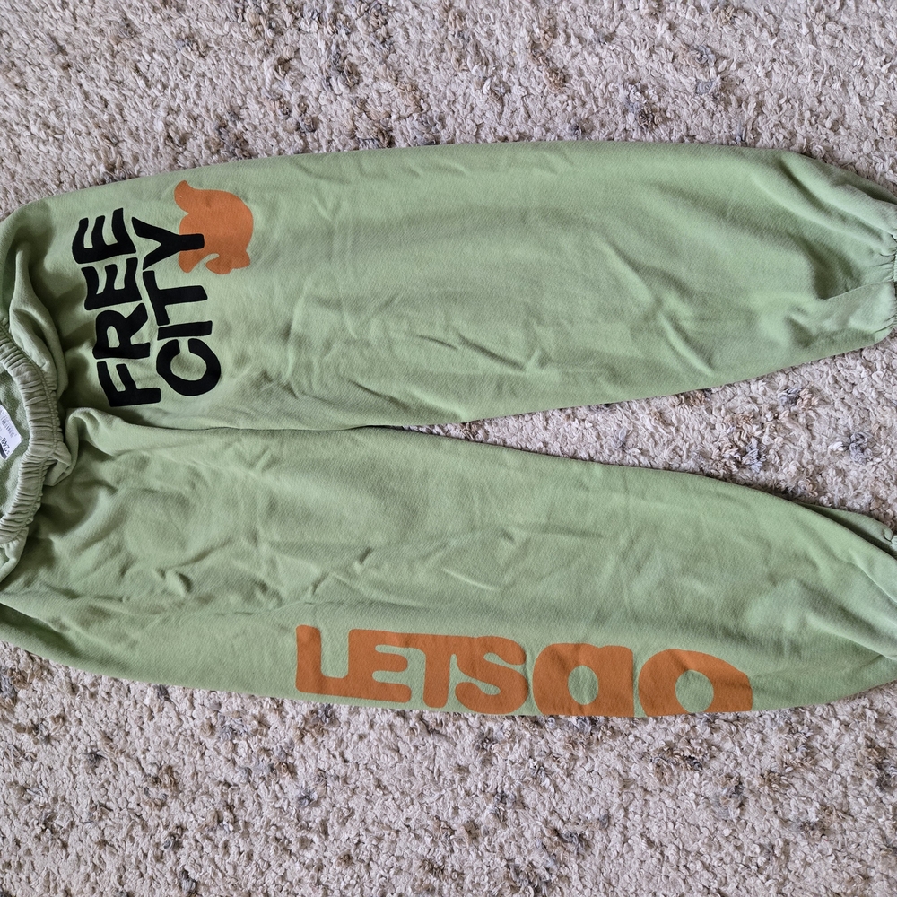 Green Sweatpants with Orange and Black Print